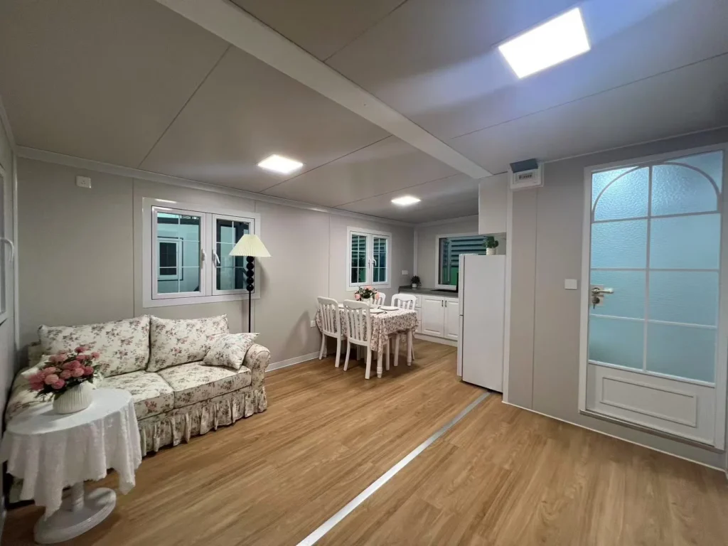 ADU build cost - open-plan living and kitchen area inside a 20ft expandable unit