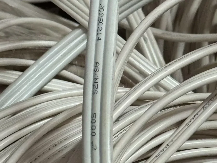 Coiled electrical wiring with AS/NZS standard marking printed on the sheath