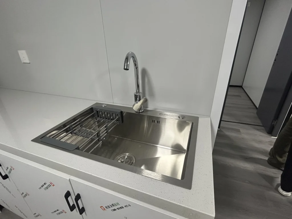 kitchen pod - stainless sink detail in a factory-fitted kitchen
