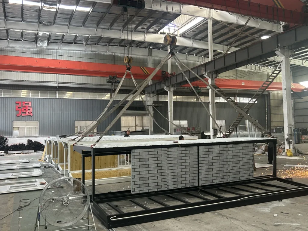 Modular ADU - workshop crane lifting a module during assembly