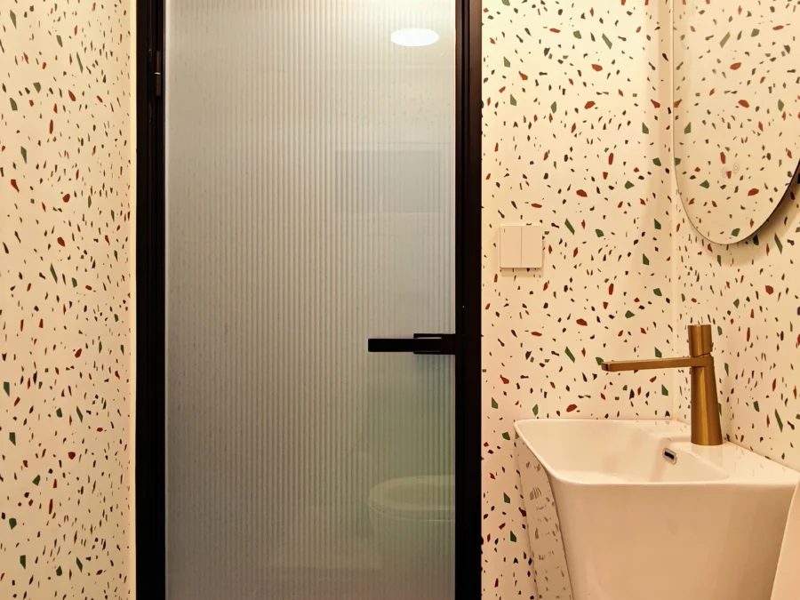 10ft expandable container house shower area with gold-finish shower set