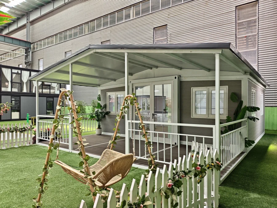 20ft container house garden terrace with swing seat and white picket fence