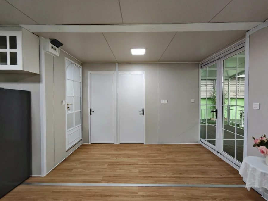 20ft container house bedroom with lace curtains facing the garden