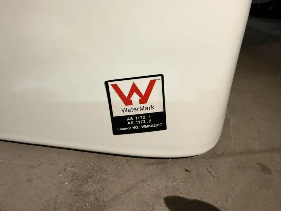 Close-up of the WaterMark certification mark on a ceramic washbasin