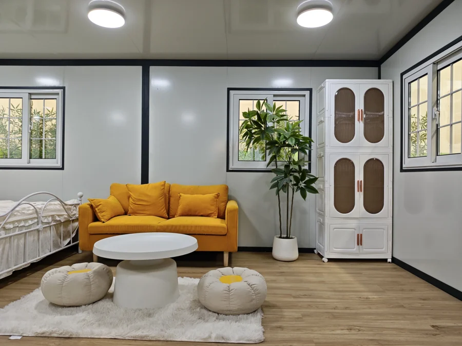 F720 compact expandable container house lounge with orange sofa