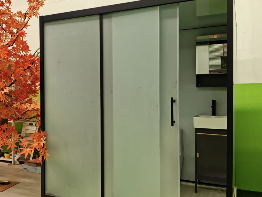 Modular bathroom pod finished unit with frosted glass sliding door