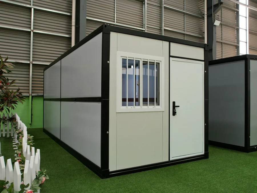 Waist-fold container houses folded flat in the factory yard